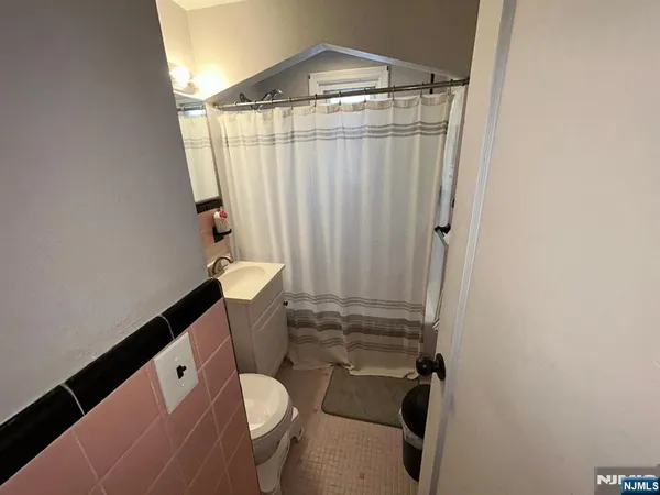 a bathroom with a sink and toilet
