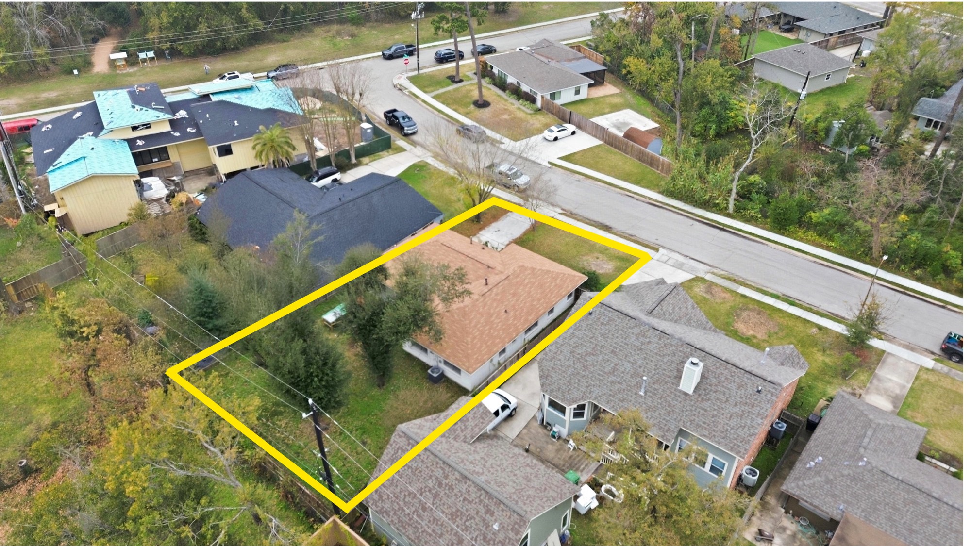 an aerial view of a house with a swimming pool