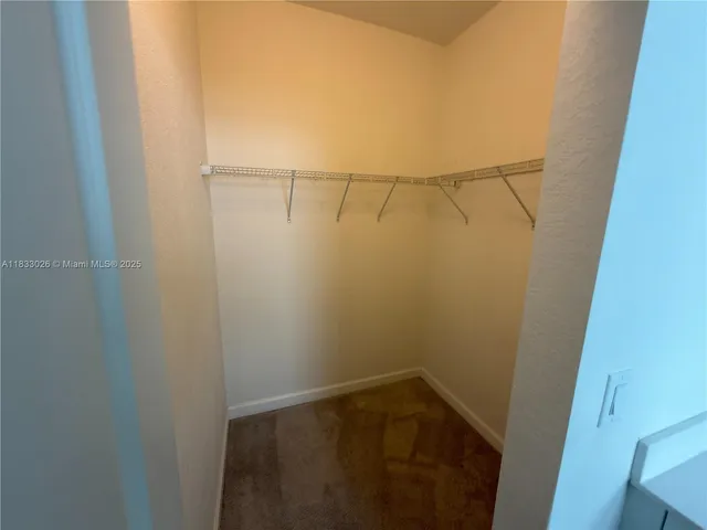 a view of storage and utility room with empty racks