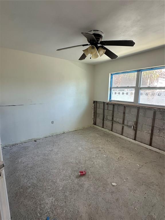 13434 1st Street East Madeira Beach, FL 33708 - Photo 11 of 15 an empty room with windows