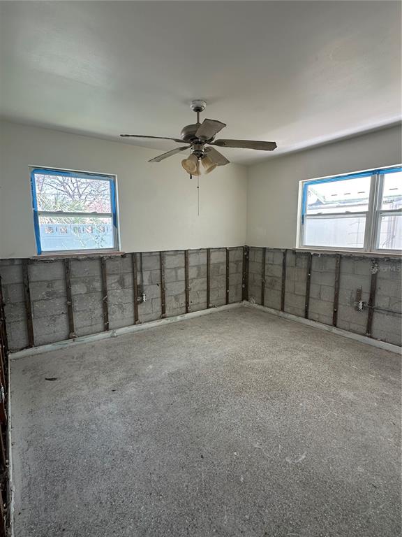 13434 1st Street East Madeira Beach, FL 33708 - Photo 13 of 15 a view of a livingroom with a ceiling fan and window