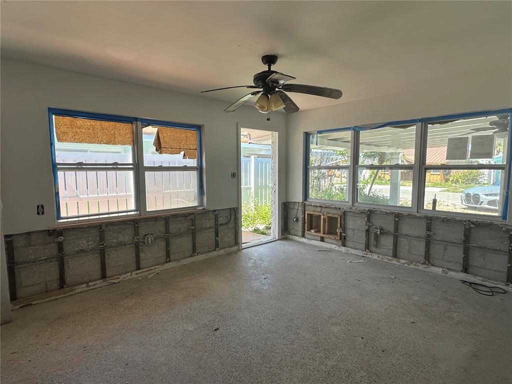 13434 1st Street East Madeira Beach, FL 33708 - Photo 2 of 15 a view of an empty room with a window