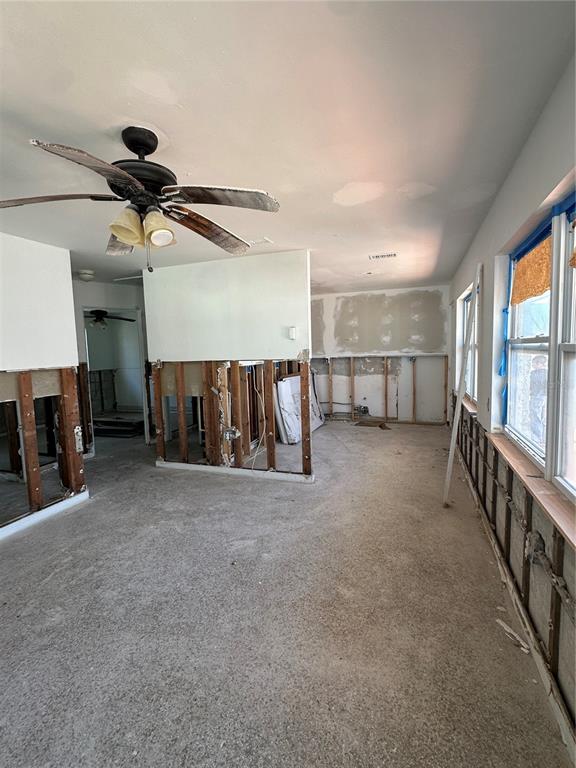 13434 1st Street East Madeira Beach, FL 33708 - Photo 4 of 15 a view of a livingroom with furniture and staircase