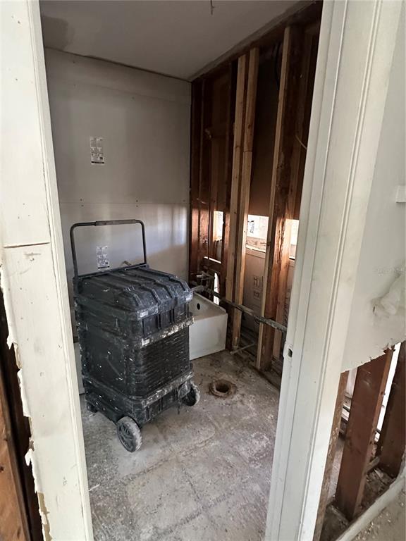 13434 1st Street East Madeira Beach, FL 33708 - Photo 7 of 15 a room with a mirror and a window