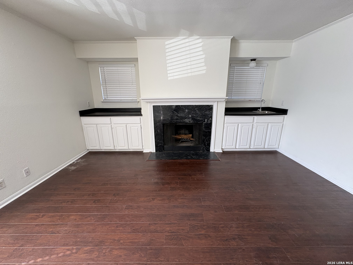 7738 Chambers Road, Unit 1101 San Antonio, TX 78229 - Photo 18 of 35 a view of a kitchen with an empty space and a fireplace