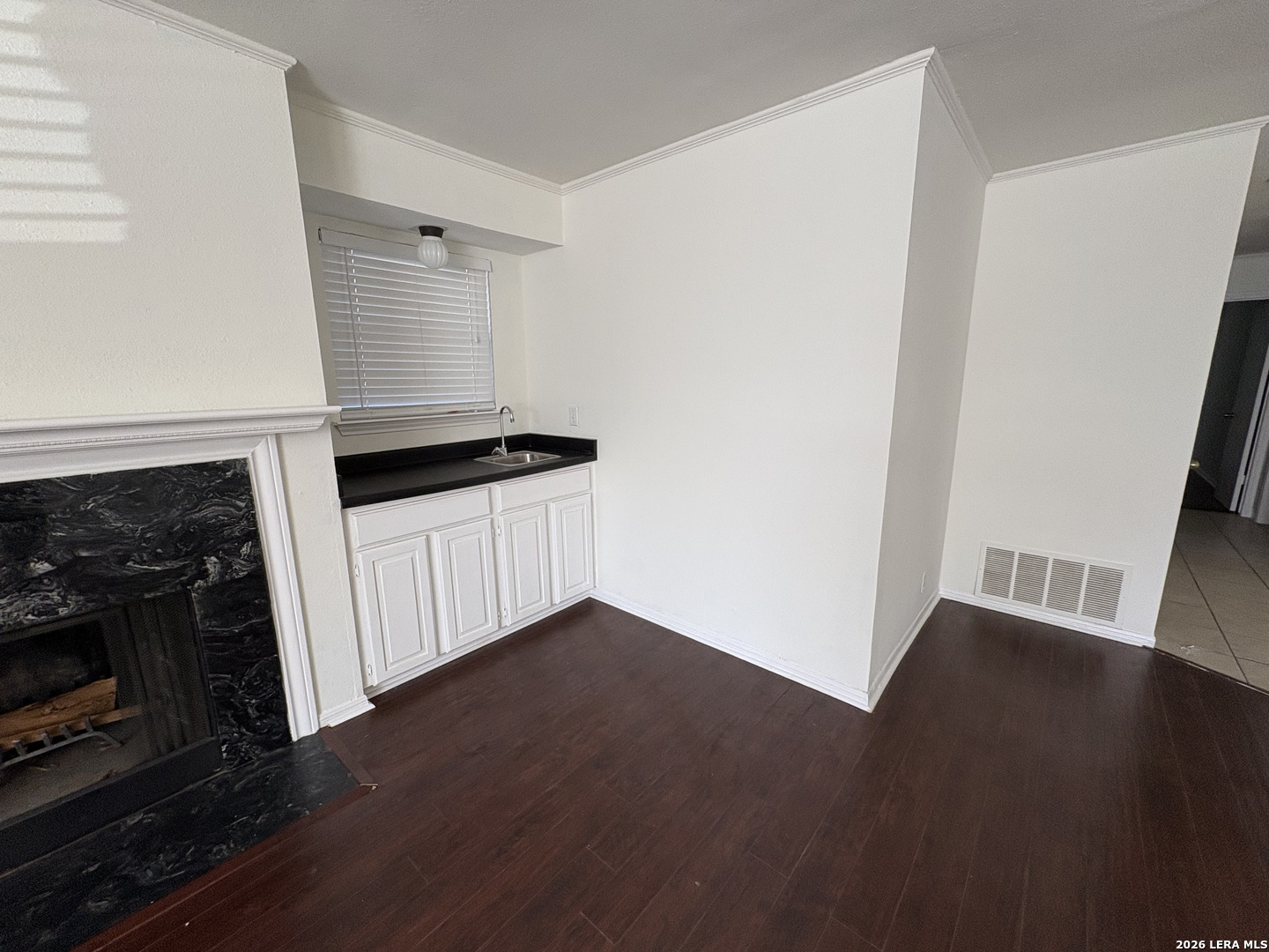 7738 Chambers Road, Unit 1101 San Antonio, TX 78229 - Photo 19 of 35 a kitchen with granite countertop a stove and a wooden floor