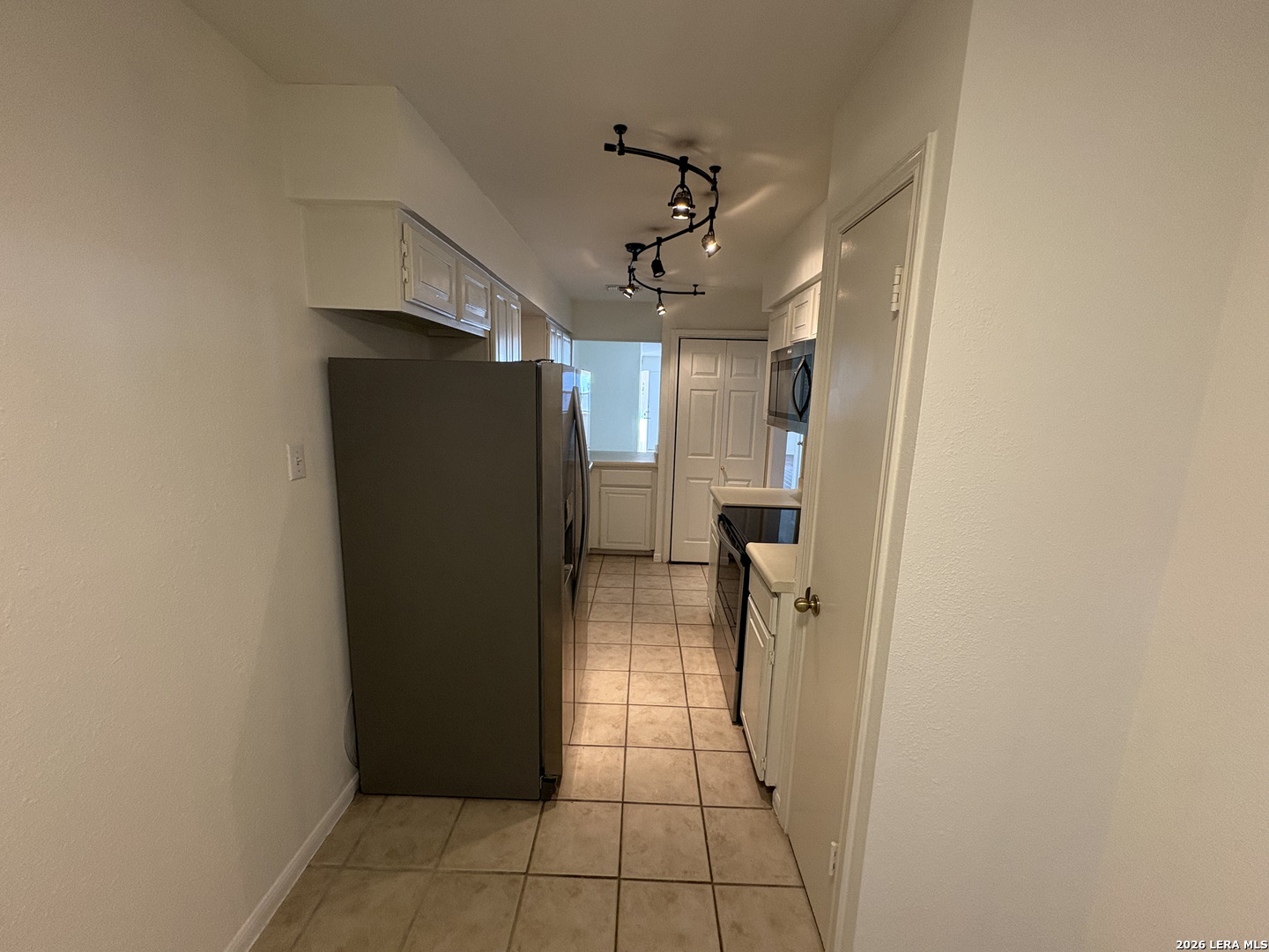 7738 Chambers Road, Unit 1101 San Antonio, TX 78229 - Photo 28 of 35 a view of a hallway