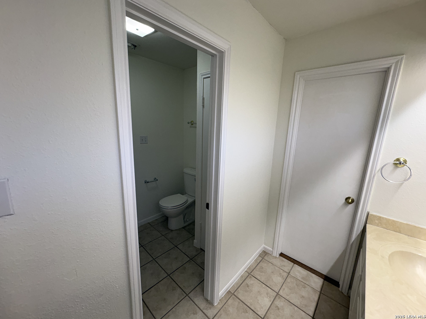7738 Chambers Road, Unit 1101 San Antonio, TX 78229 - Photo 35 of 35 a bathroom with a granite countertop sink toilet and shower