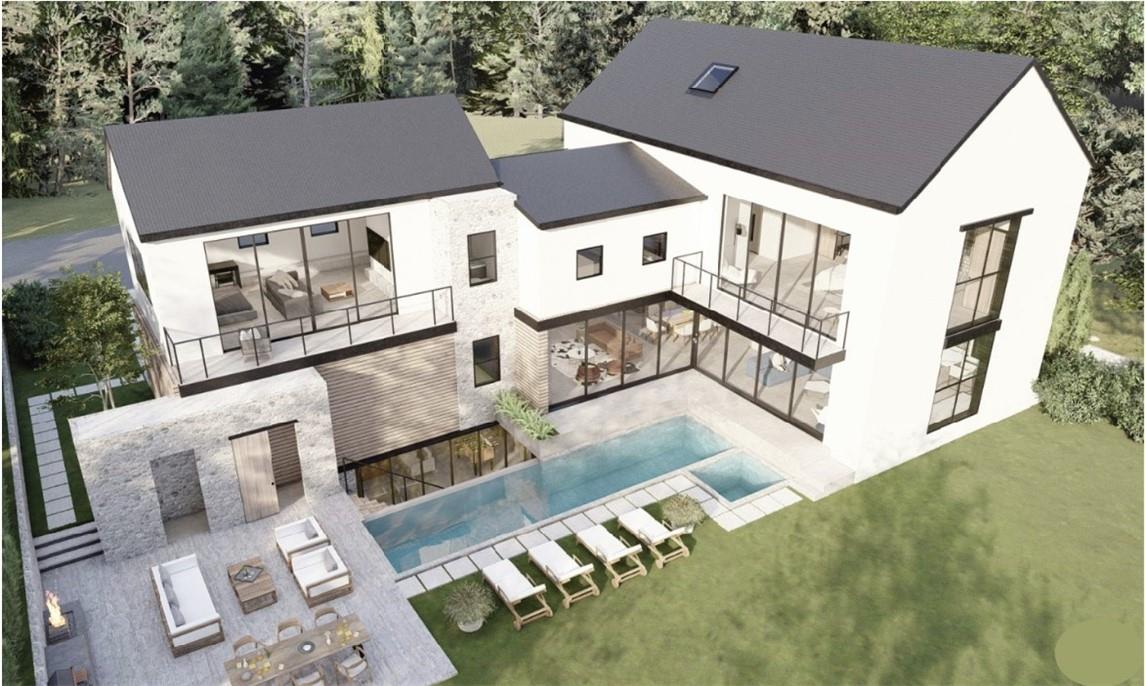 a aerial view of a house with a big yard