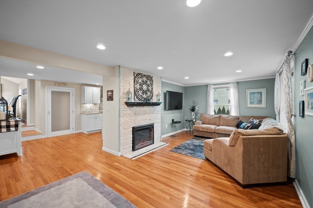 6 Alderbrook Road Andover, MA 01810 - Photo 4 of 29 a living room with furniture wooden floor and a fireplace
