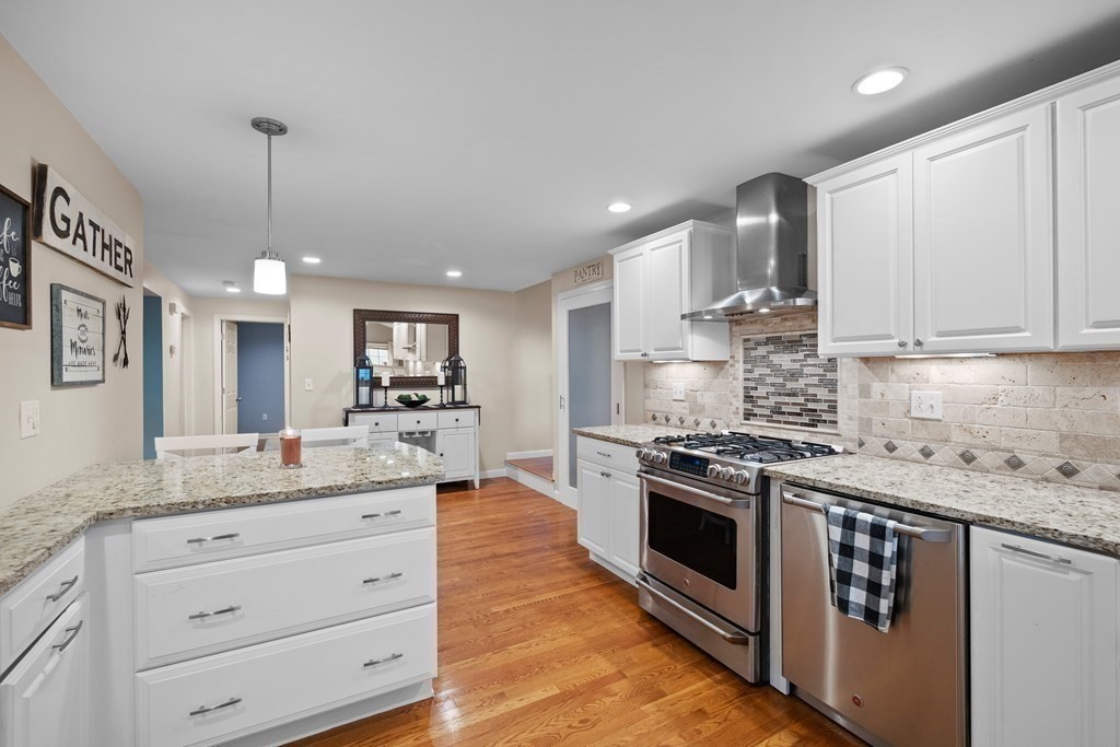 6 Alderbrook Road Andover, MA 01810 - Photo 6 of 29 a kitchen with stainless steel appliances granite countertop a stove a sink and a refrigerator