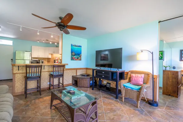 a living room with furniture and a flat screen tv