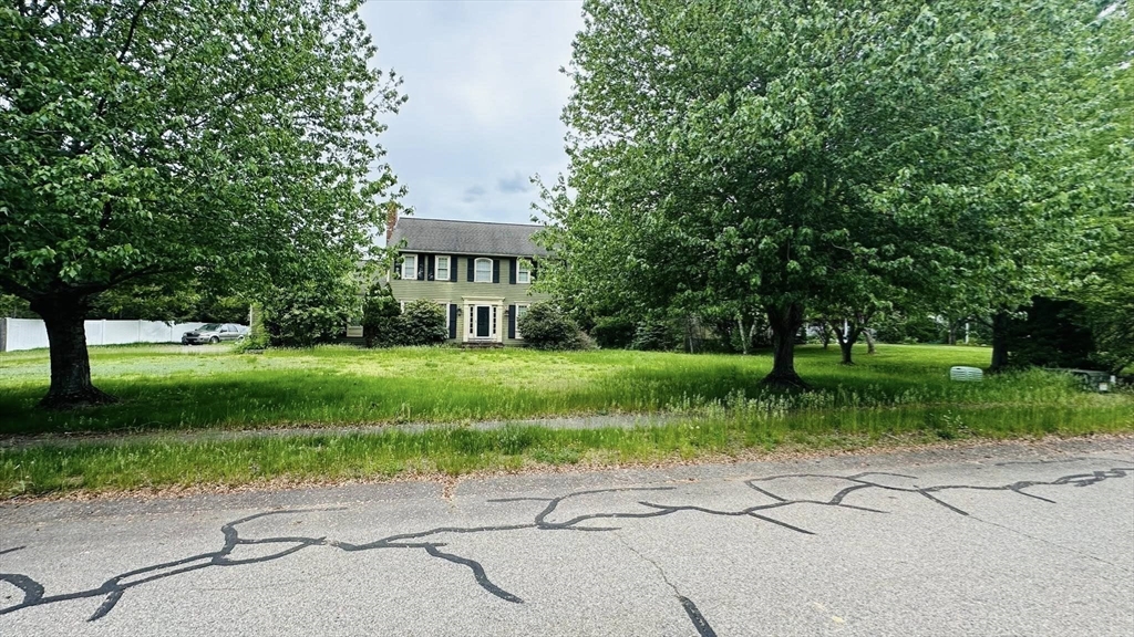 4 Canoe River Road Easton, MA 02375 - Photo 2 of 9 a view of a park with plants and large trees