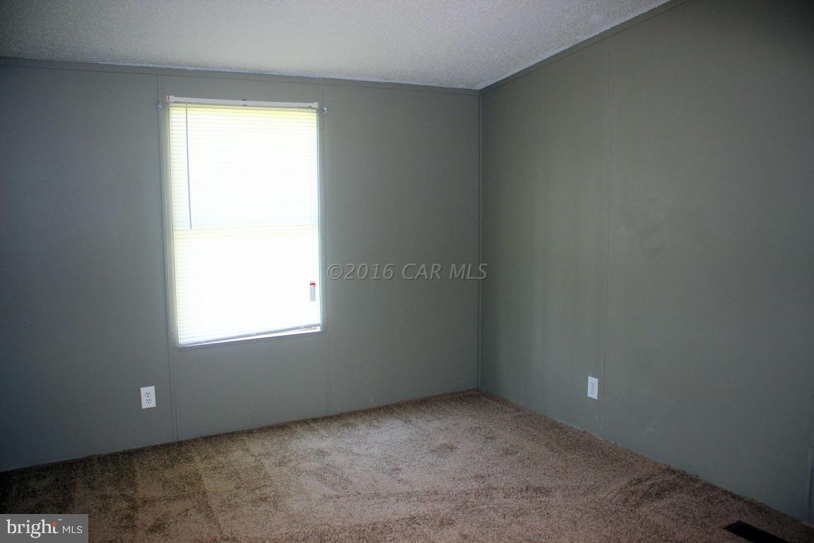 10841 Oriole Back Road Princess Anne, MD 21853 - Photo 9 of 12 an empty room with a window