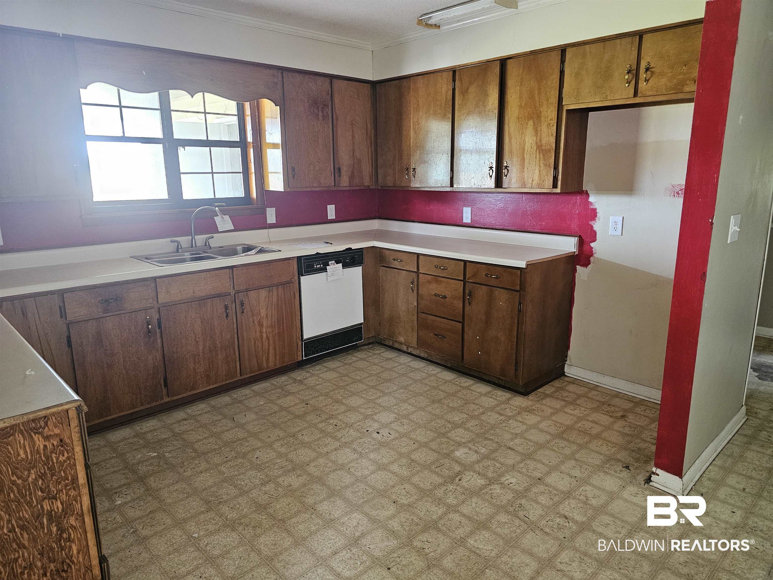 59575 Lottie Road Atmore, AL 36502 - Photo 9 of 23 Kitchen with white dishwasher, light countertops, light floors, and a sink