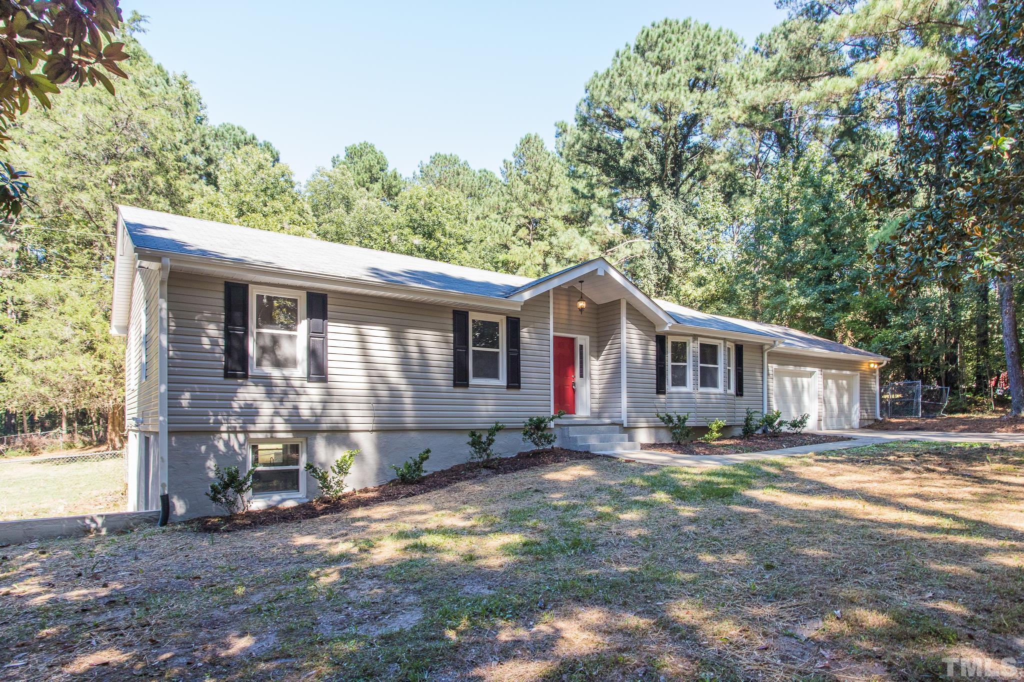 4809 Pearl Road Raleigh, NC 27610 - Photo 1 of 34 a front view of a house with yard