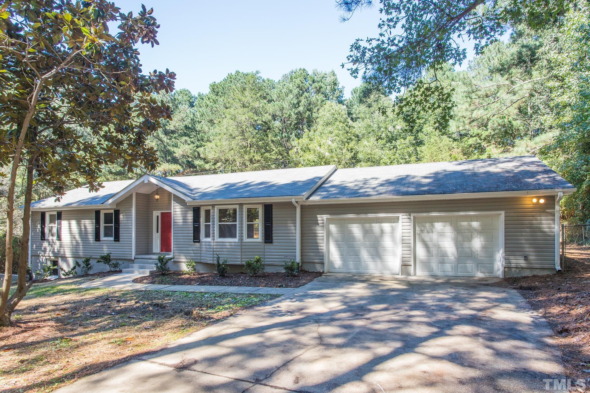 4809 Pearl Road Raleigh, NC 27610 - Photo 3 of 34 a front view of a house with a garden
