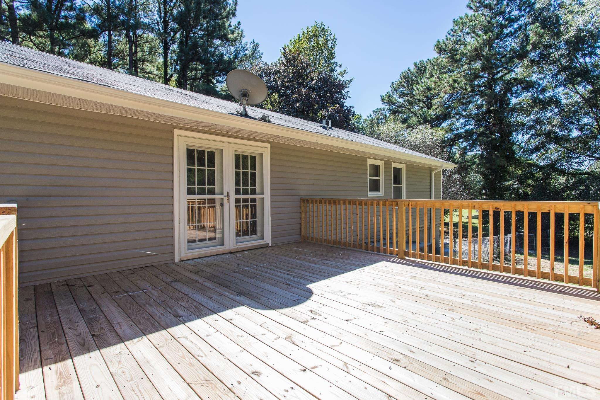 4809 Pearl Road Raleigh, NC 27610 - Photo 6 of 34 a view of a wooden deck