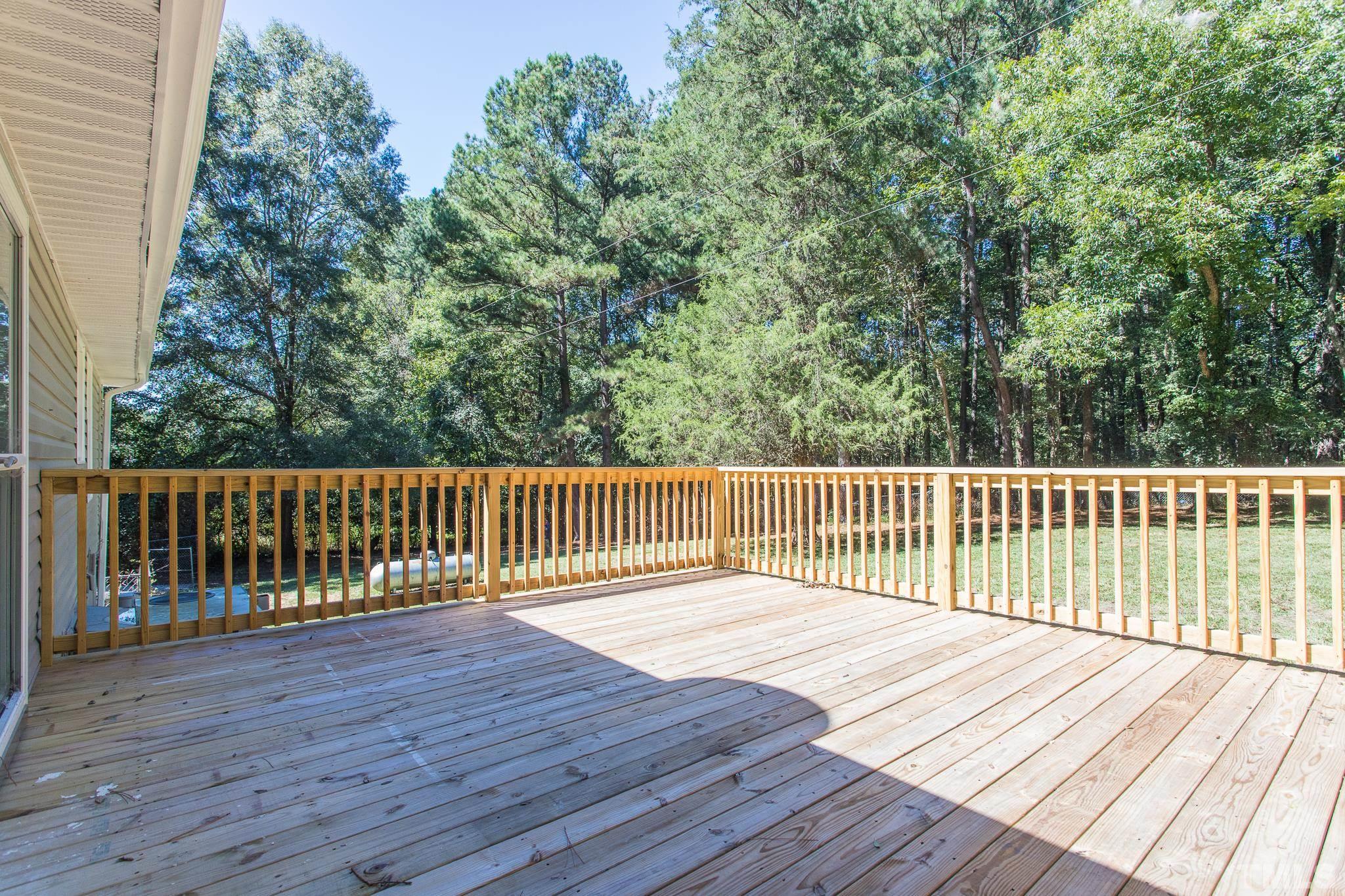 4809 Pearl Road Raleigh, NC 27610 - Photo 7 of 34 a balcony with wooden floor