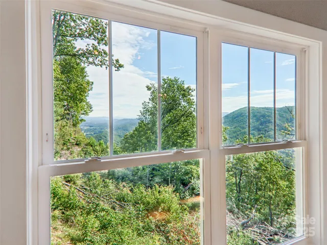a kitchen with granite countertop a sink stove and refrigerator