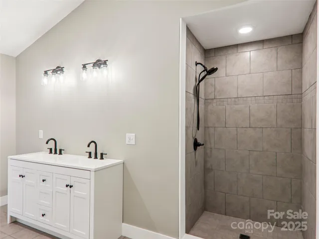 an empty room with wooden floor and window