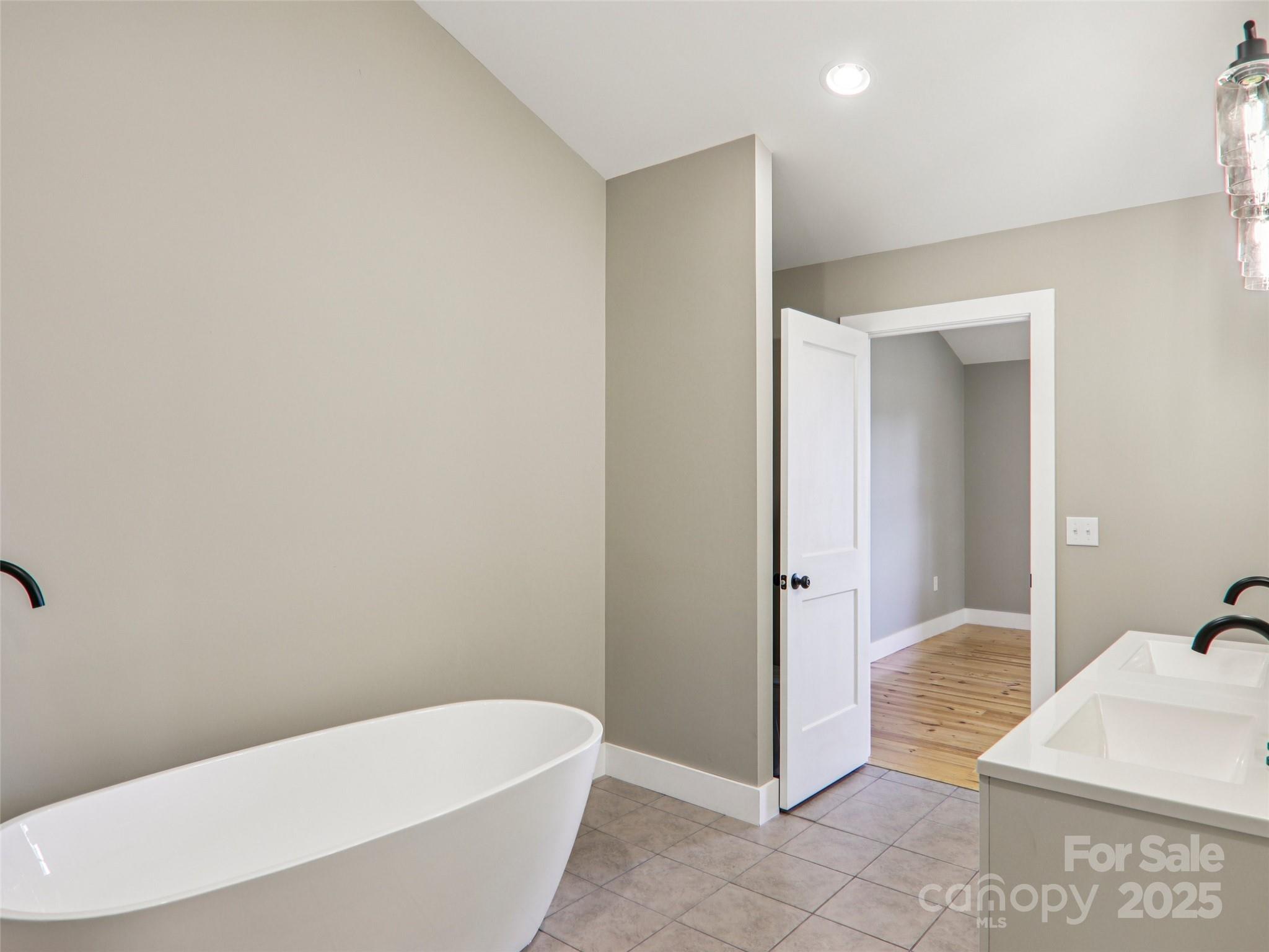 366 Ben Nevis Road Brevard, NC 28712 - Photo 27 of 48 a bathroom with a bathtub and shower