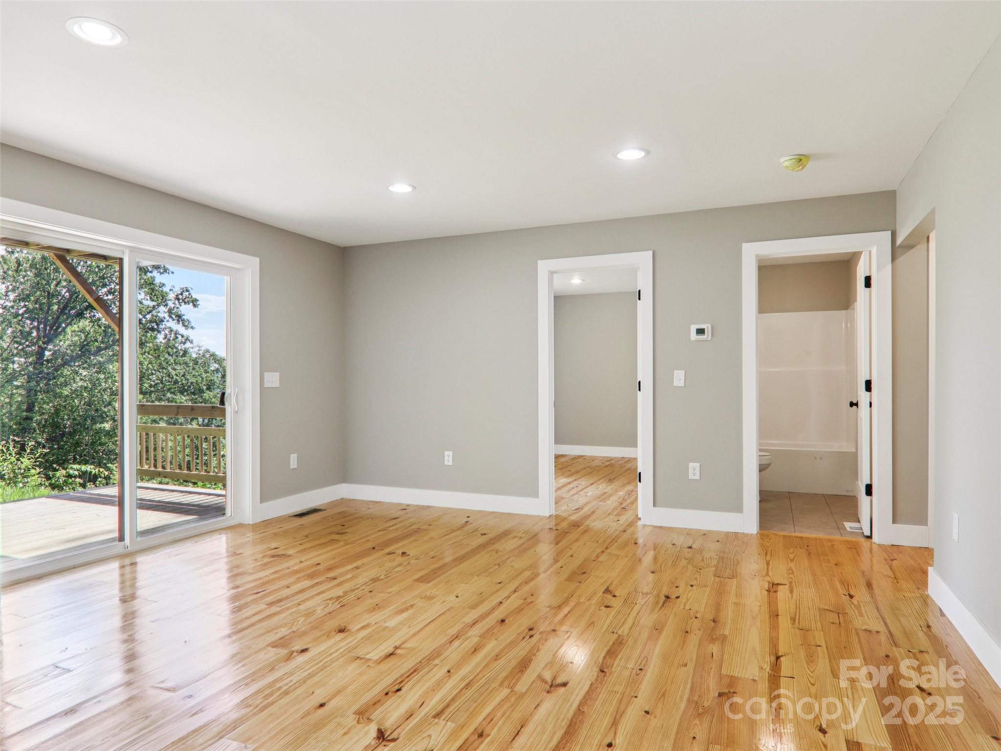 366 Ben Nevis Road Brevard, NC 28712 - Photo 34 of 48 a view of empty room with wooden floor and fan