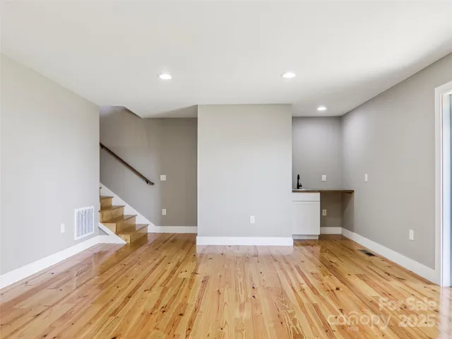 a view of a balcony with wooden floor