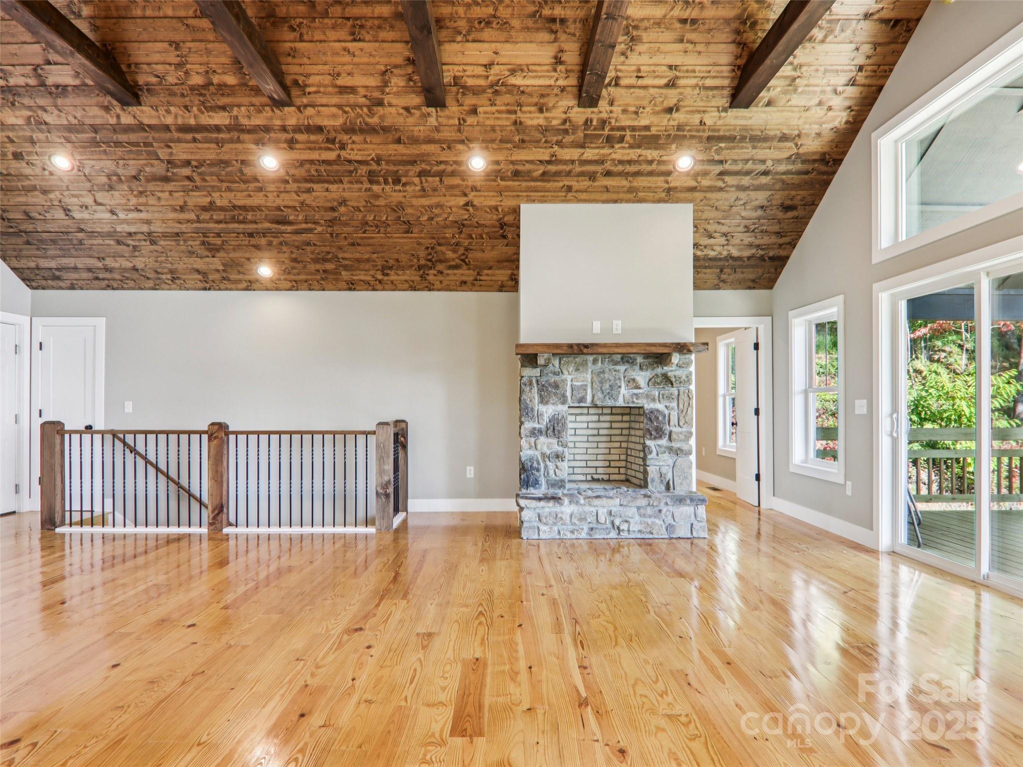 366 Ben Nevis Road Brevard, NC 28712 - Photo 8 of 48 a view of a livingroom with wooden floor and a fireplace