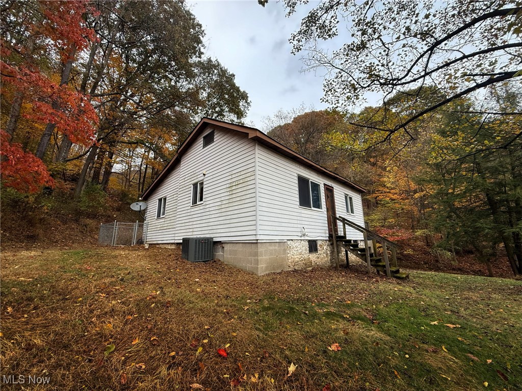4589 Harmon Creek Road Colliers, WV 26035 - Photo 4 of 26 View of side of home with a lawn