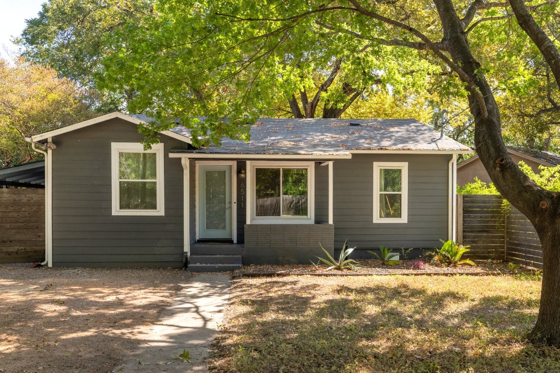 6511 Chesterfield Avenue Austin, TX 78752 - Photo 1 of 27 a front view of a house with a yard