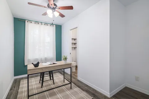 a room with a table and chairs