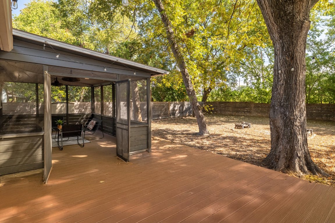 6511 Chesterfield Avenue Austin, TX 78752 - Photo 21 of 27 a backyard of a house with table and chairs