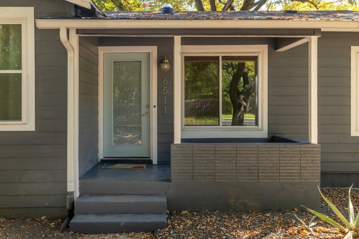 6511 Chesterfield Avenue Austin, TX 78752 - Photo 3 of 27 a view of a door of a house with a wooden door