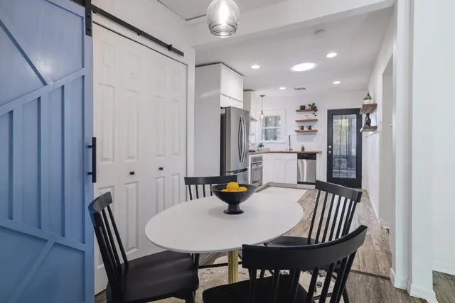 a view of a dining room with furniture
