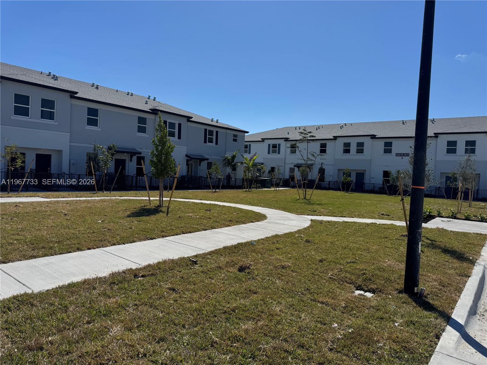 a view of a building with a yard
