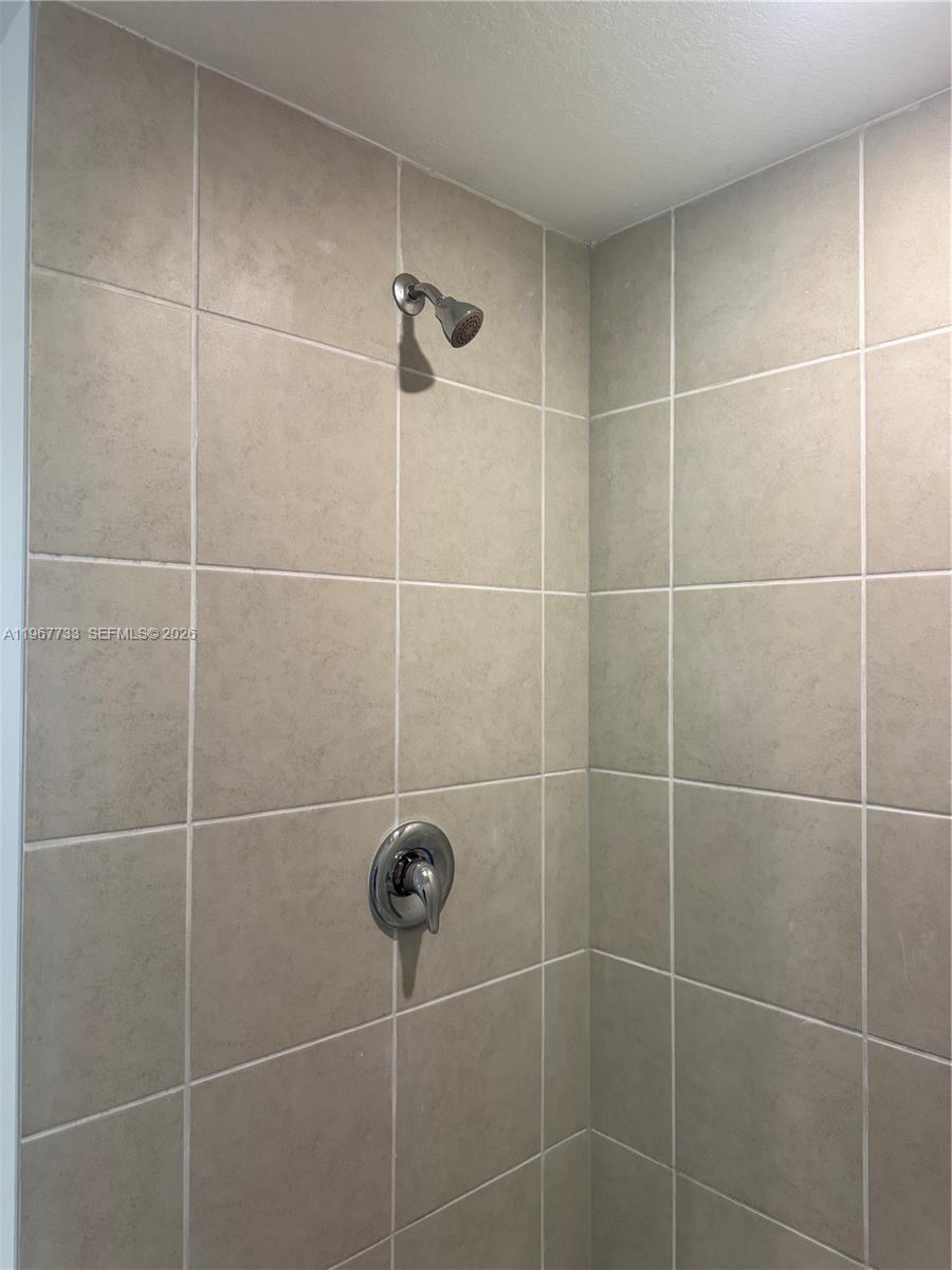 12420 Southwest 248th Street, Unit 7 Homestead, FL 33032 - Photo 15 of 31 a bathroom with a shower