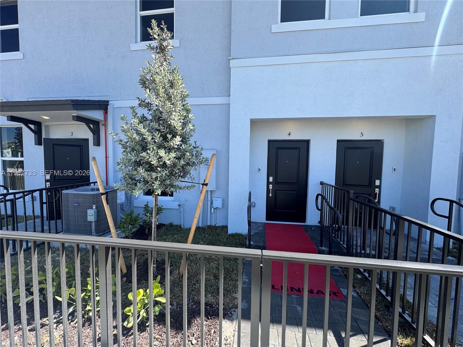 12420 Southwest 248th Street, Unit 7 Homestead, FL 33032 - Photo 29 of 31 a view of a balcony with an outdoor space