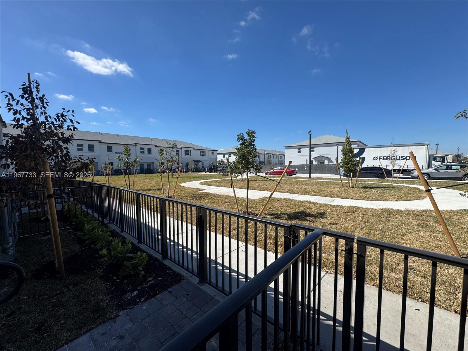12420 Southwest 248th Street, Unit 7 Homestead, FL 33032 - Photo 3 of 31 a view of a balcony with wooden floor