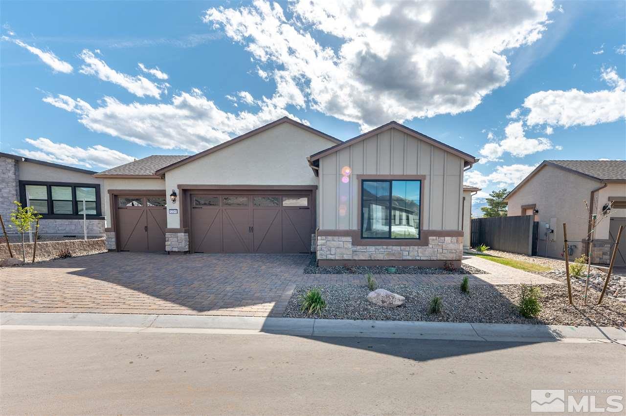 12245 Pewter Point Street, Unit HOMESITE 40 Reno, NV 89521 - Photo 1 of 10 a front view of a house with garden