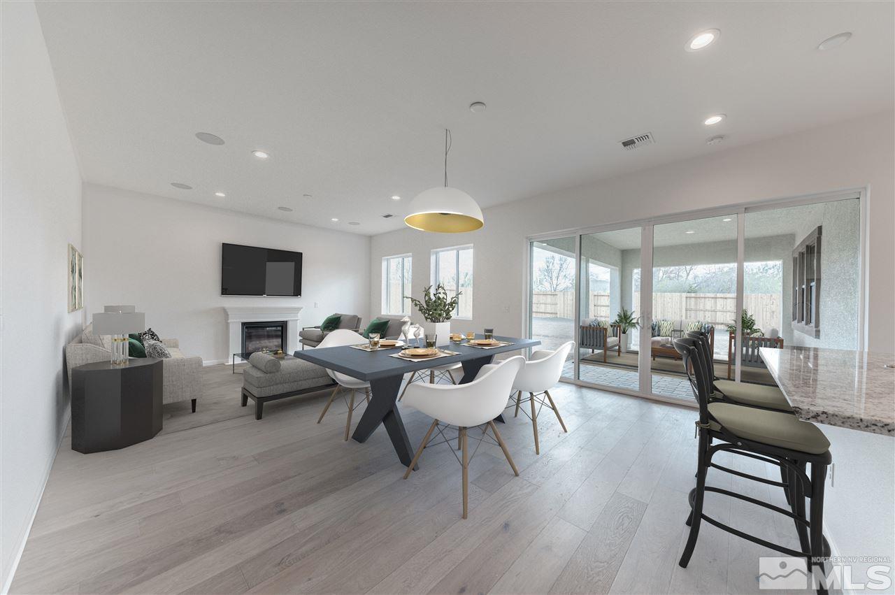 12245 Pewter Point Street, Unit HOMESITE 40 Reno, NV 89521 - Photo 3 of 10 a living room with fireplace furniture and a wooden floor