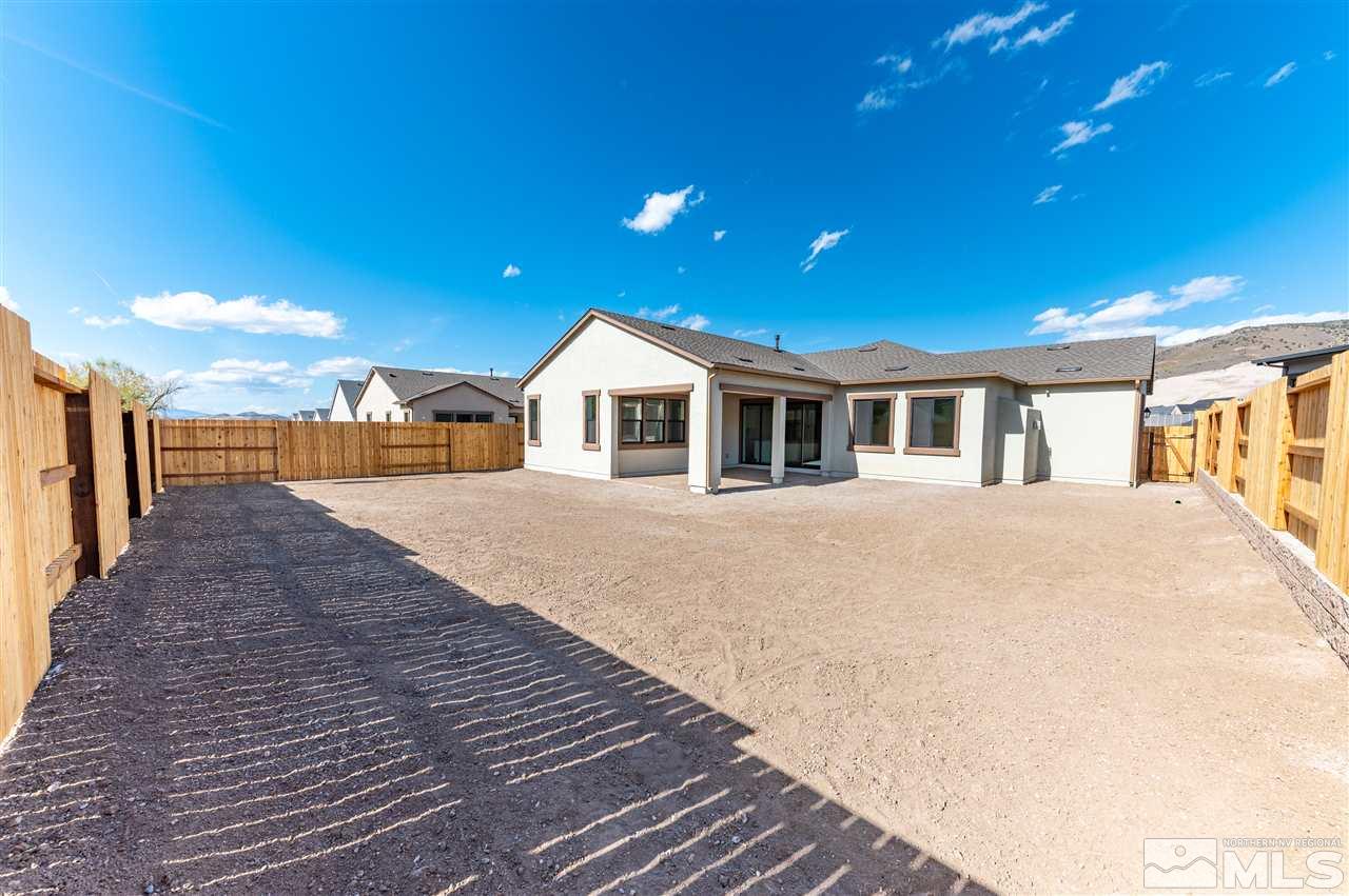 12245 Pewter Point Street, Unit HOMESITE 40 Reno, NV 89521 - Photo 10 of 10 a view of a house with a backyard
