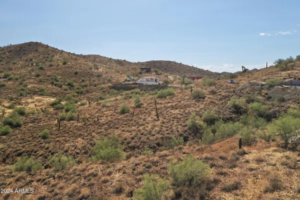 a view of a large mountain with mountains in the background
