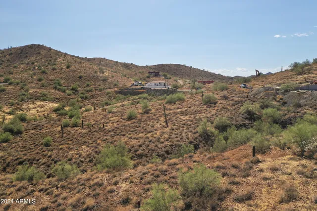 a view of a large mountain with mountains in the background