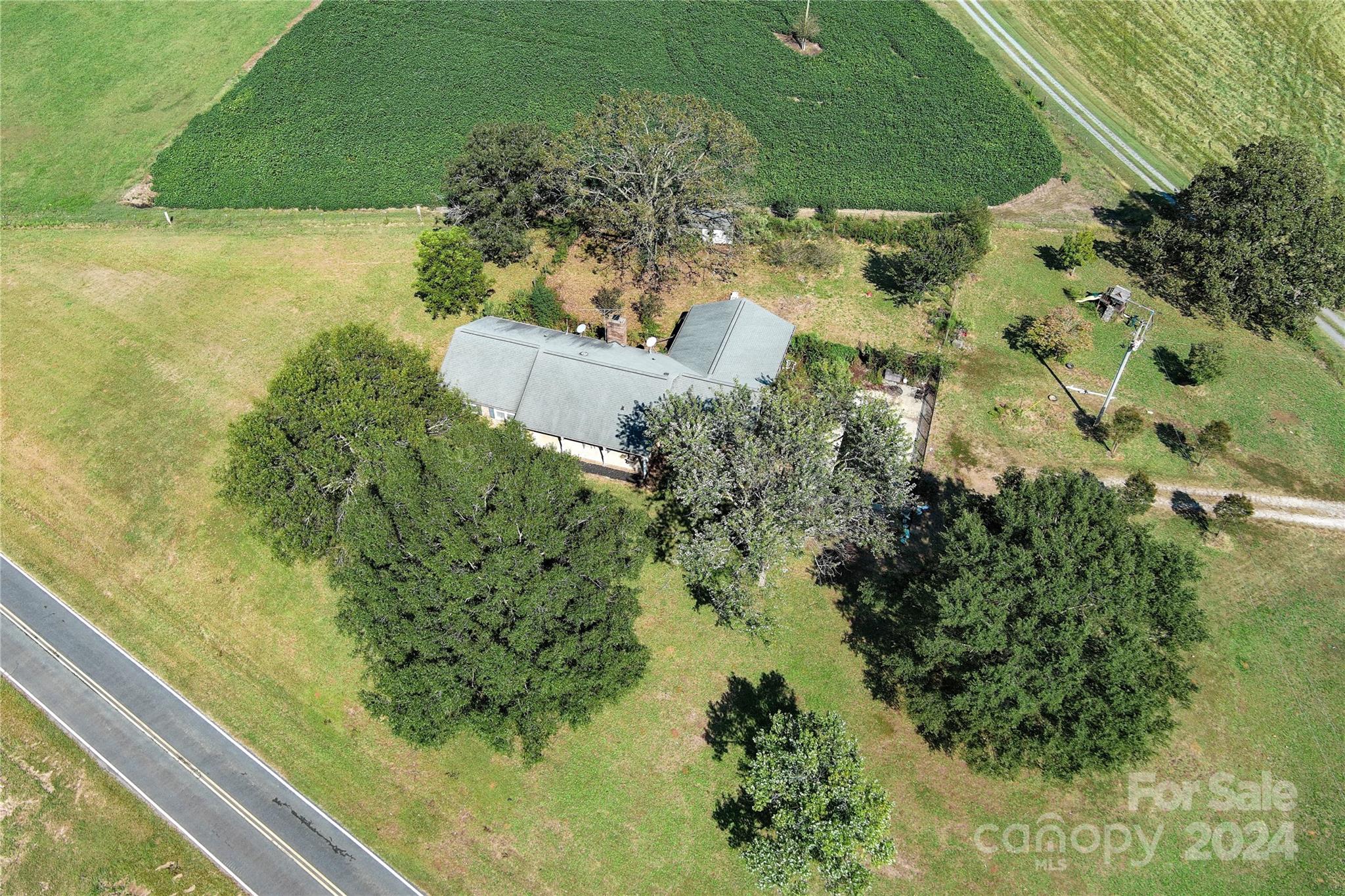 4523 Belk Mill Road Monroe, NC 28112 - Photo 35 of 37 a view of a garden with a lake view