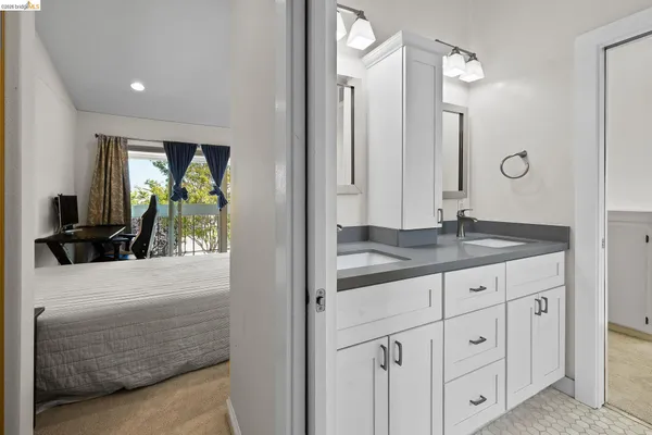a bathroom with a granite countertop sink a vanity and a mirror