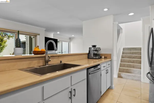 a kitchen with a sink and cabinets
