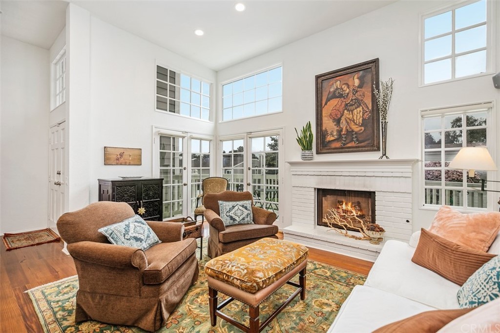 33253 Ocean Ridge, Unit 31 Dana Point, CA 92629 - Photo 1 of 1 a living room with furniture and a fireplace