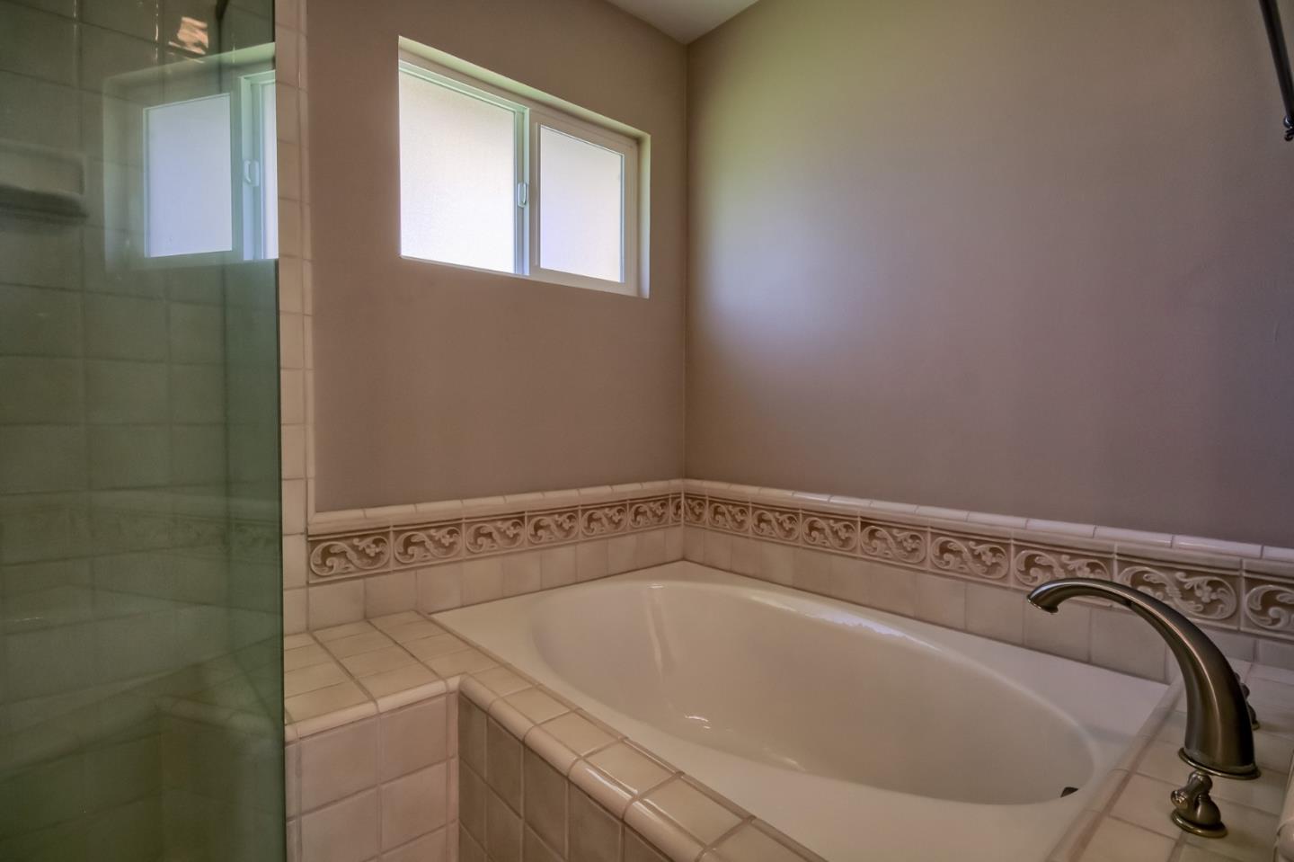 22305 Montera Drive Salinas, CA 93908 - Photo 11 of 20 a bathroom with a bathtub and window