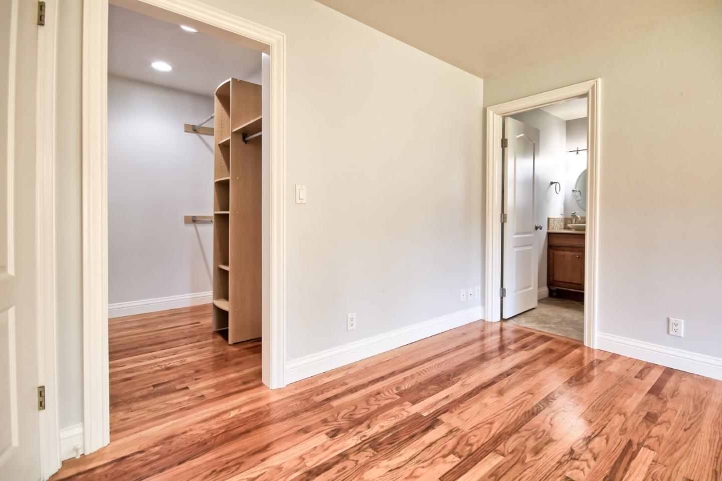 22305 Montera Drive Salinas, CA 93908 - Photo 14 of 20 a view of hallway with wooden floor and staircase